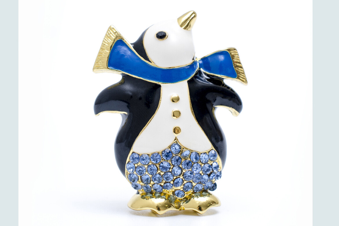 brooch penguin with diamonds isolated on white